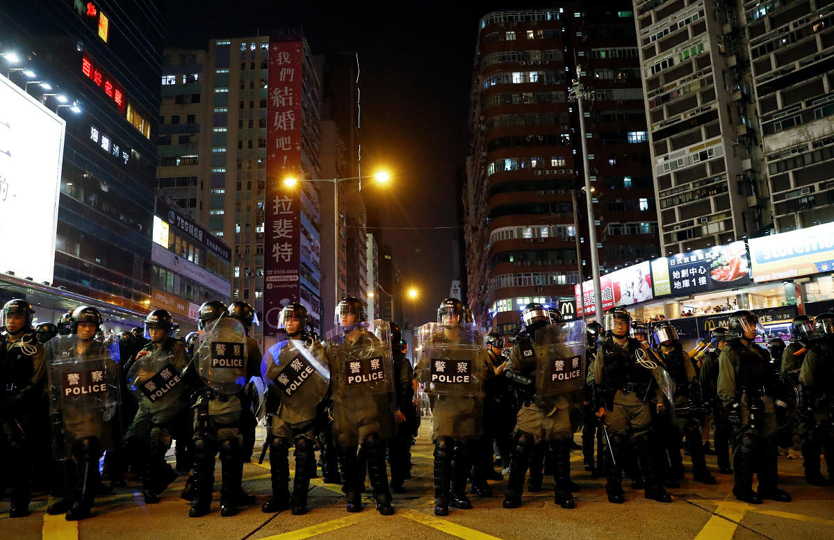 Riot police officers are seen near Mong Kok police station in Hong Kong. (Reuters Photo)