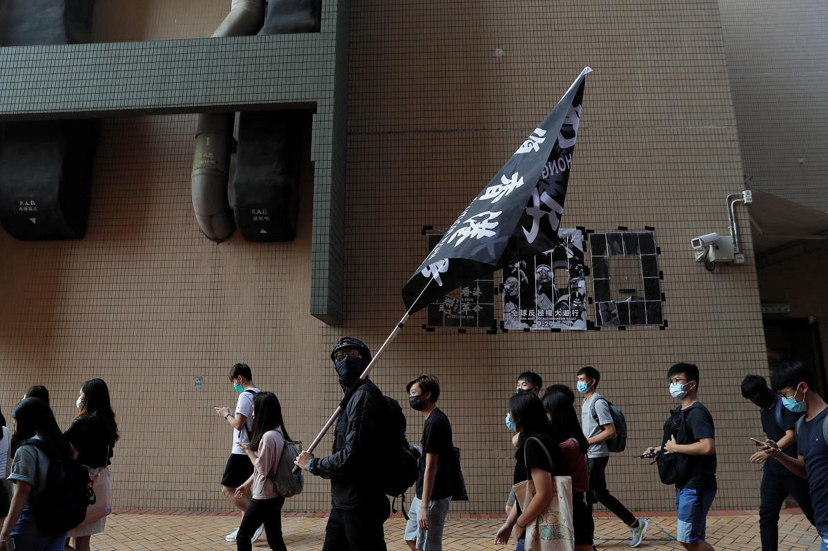 Students at Hong Kong Baptist University take part in a rally after police entered the campus on Sunday while chasing protesters, in Hong Kong, China October 8, 2019. (REUTERS)