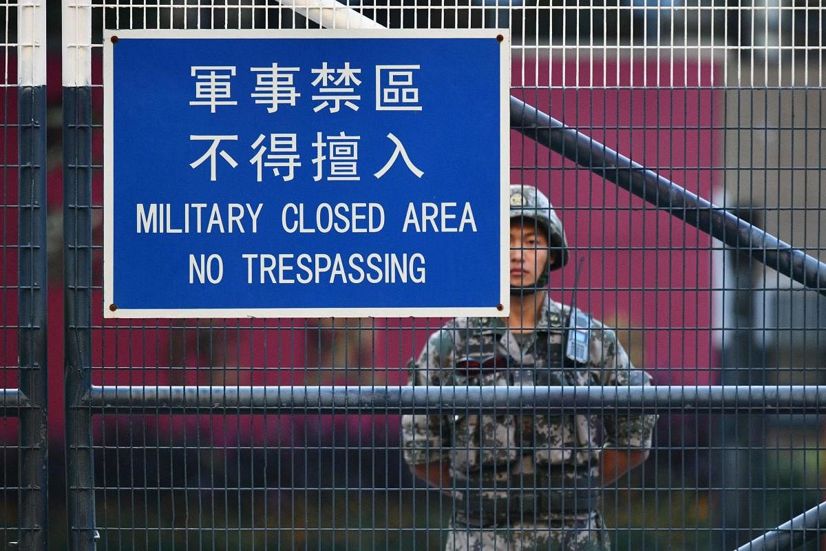 A member of China’s People's Liberation Army (PLA) stands guard inside Osborn Barracks in Kowloon Tong in Hong Kong on November 16, 2019. (AFP)