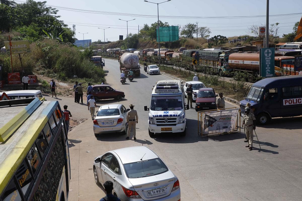 Lorries were not allowed to travel towards Mangaluru at Talapady. DH Photo/Mohan Kuthar