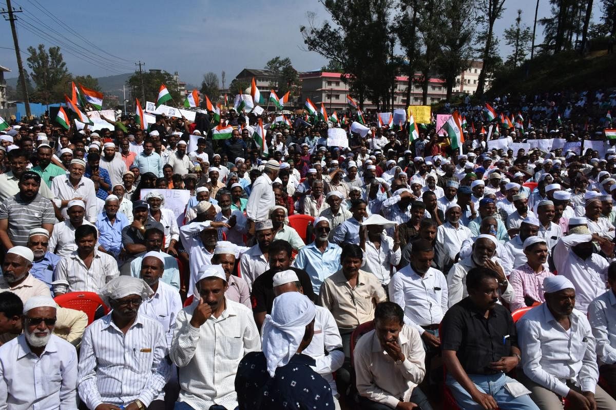 Protesters gather at Gandhi Maidan, as a part of a protest meet organised by Kodagu Muslim Jama at Okkoota in Madikeri on Tuesday. DH Photo