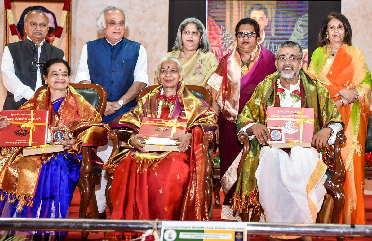 Sri Jayachamarajendra Prashasthi was conferred on musicologists Sukanya Prabhakar, T S Satyavathi and R Satyanarayana (Posthumous), during the third segment of H H Sri Jayachamaraja Wadiyar birth centenary celebrations, at Senate Bhavan in Mysuru on Thursday. Nandakumar, son of Satyaranarayana, received the award. Rajya Sabha MP Jairam Ramesh, Kamakshi Devi and Indrakshi Devi daughters of Wadiyar and president of Srikantadatta Narasimharaja Wadiyar Foundation Pramoda Devi Wadiyar are seen. dh photo