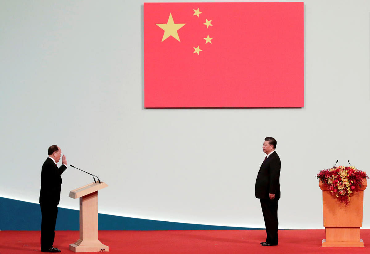 Macau Chief Executive Ho Iat-seng takes an oath in front of Chinese President Xi Jinping at a ceremony on the 20th anniversary of the former Portuguese colony's return to China in Macau. Reuters