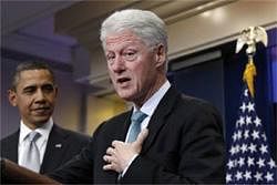 U.S. President Barack Obama (L) looks on as former President Bill Clinton gestures while speaking to the press in the Brady Press Briefing Room at the White House in Washington, December 10, 2010. Clinton endorsed Obama's deal with Republicans to extend Bush-era tax cuts after the two men met at the White House on Friday.  Credit: Reuters