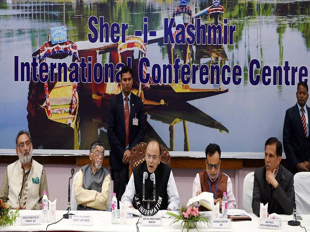 Union Finance Minister Arun Jaitley with MoS Santosh Gangwar and Reneue Secretary Hasmukh Adhia during the firsrt day of the 14th Goods and Services Tax (GST) Council at SKICC in Srinagar on Thursday. PTI Photo