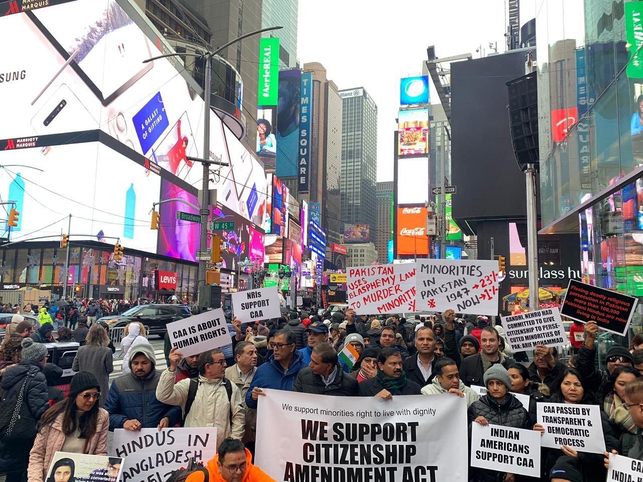 A group of Indian-Americans gathered at Times Square on Sunday, carrying placards and raising slogans in support of the Narendra Modi government and CAA. Photo/Twitter (@ThakurRanjitDas)