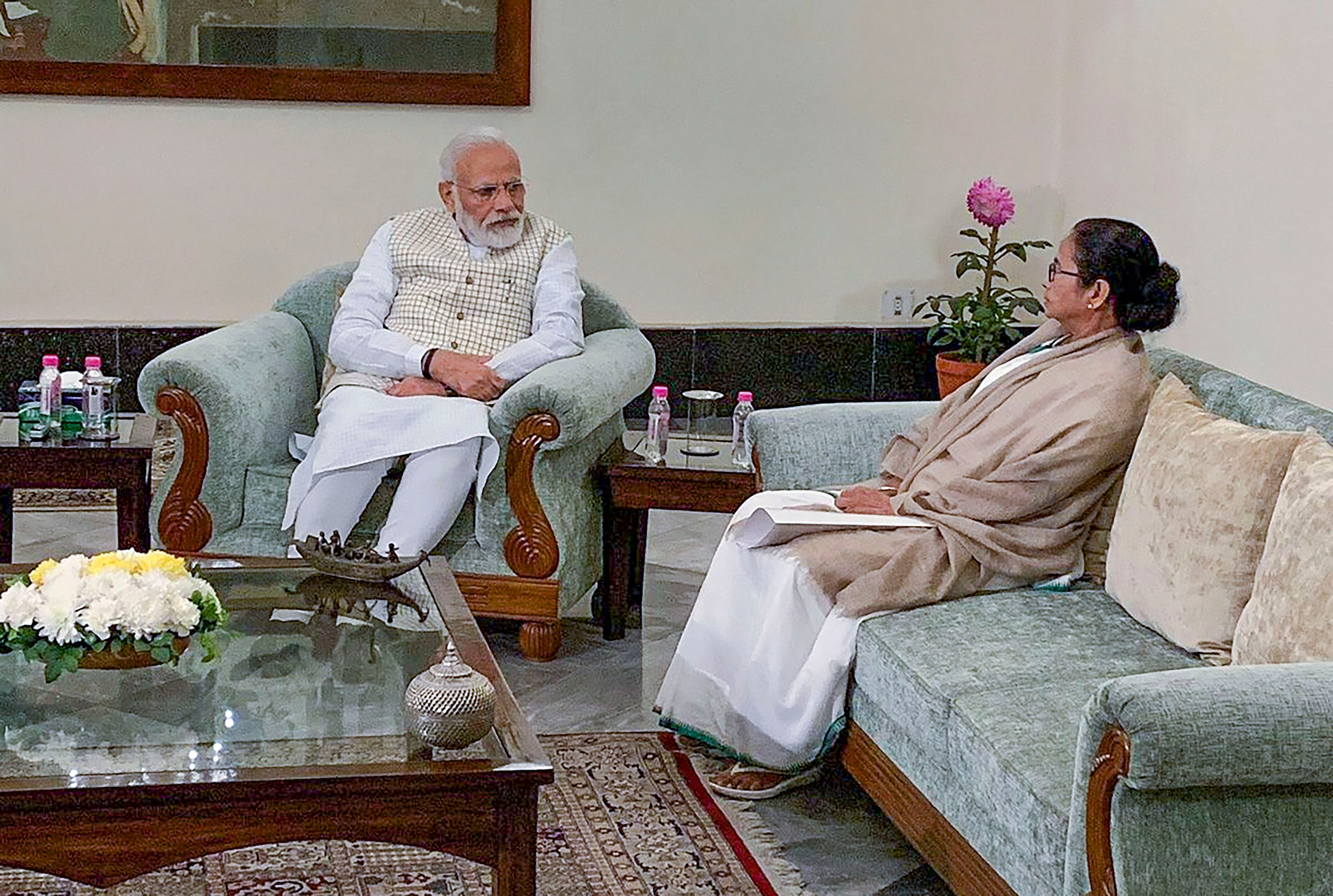 Prime Minister Narendra Modi with West Bengal CM Mamata Banerjee during a meeting in Kolkata. (PTI Photo)