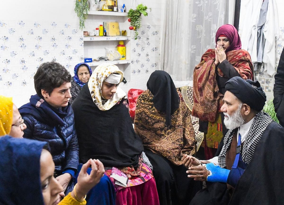 Congress General Secretary Priyanka Gandhi Vadra interacts with Ruqaiya Parveen, whose house was allegedly ransacked by the police during the violence that broke out after anti-CAA protests, in Muzaffarnagar, Uttar Pradesh. (PTI photo)