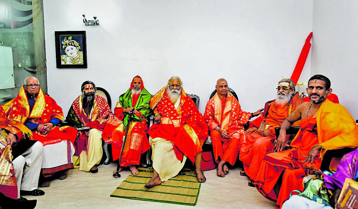 Members of the Sri Ram Janmabhoomi Teerth Kshetra, the trust setup to oversee construction of the Ram Temple at Ayodhya, during its first meeting at Greater Kailash - I in New Delhi, Wednesday, Feb. 19, 2020. Ram Janam Bhoomi Nyas chief Mahant Nritya Gopal Das (C) is also seen. Credit: PTI Photo