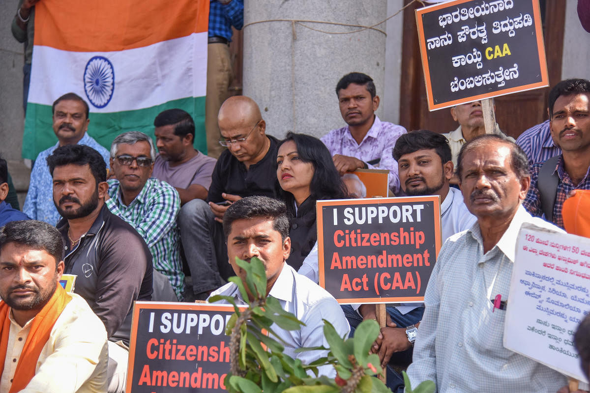 People protest in support of the Citizenship Amendment Act in front of Town Hall in Bengaluru on Sunday. DH PHOTO/S K DINESH