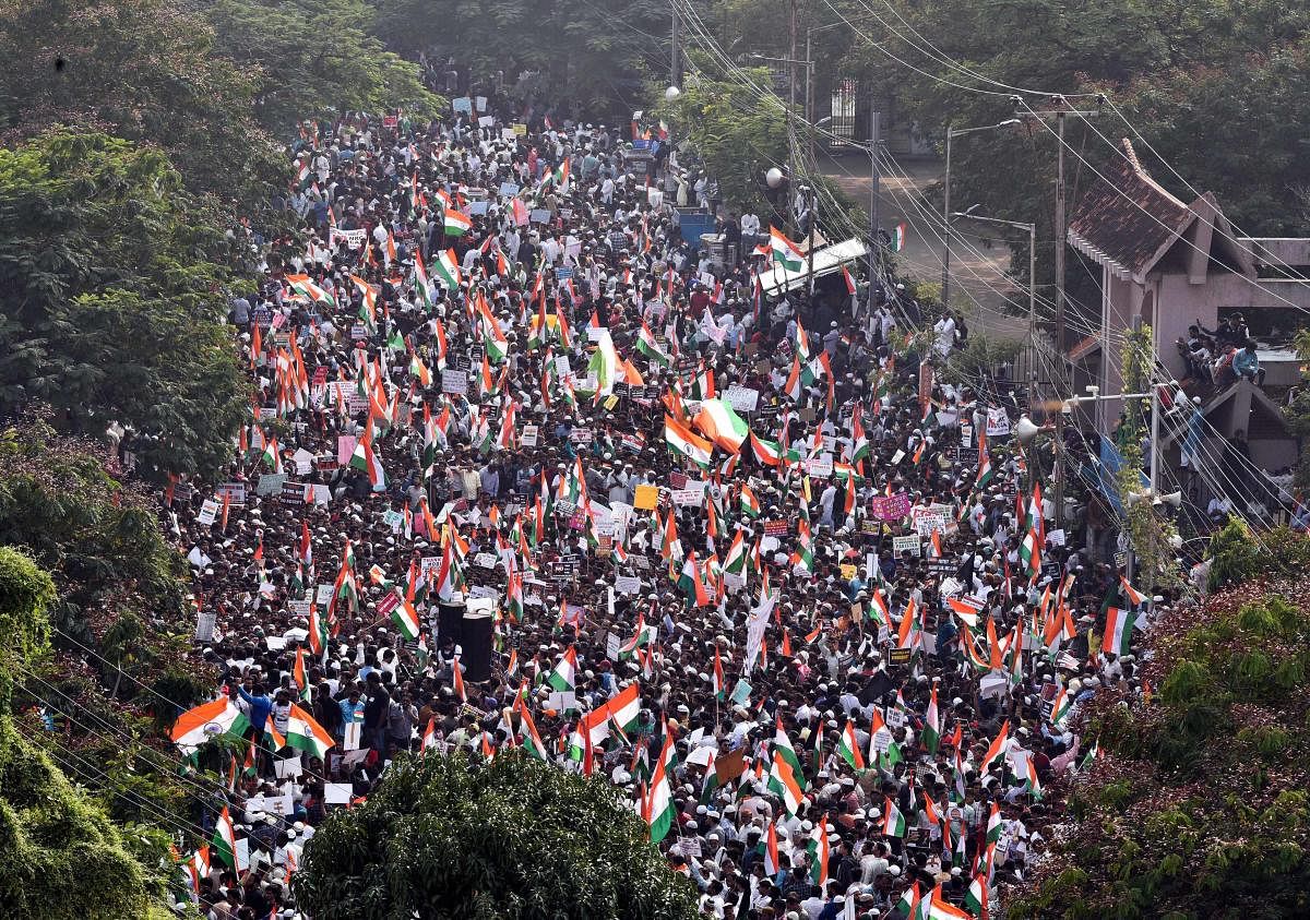 Protestors wave Indian Tri-colours during a demonstration against the amended Citizenship Act, NRC and NPR at Indira Park in Hyderabad, Saturday, Jan. 4, 2020. (PTI Photo)