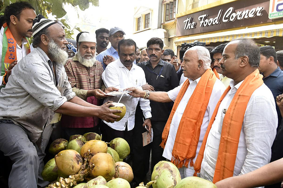 Chief Minister B S Yediyurappa, MP P C Mohan along with other BJP leaders and supporters seen during a CAA awareness campaign in Bengaluru on Sunday. DH Photo