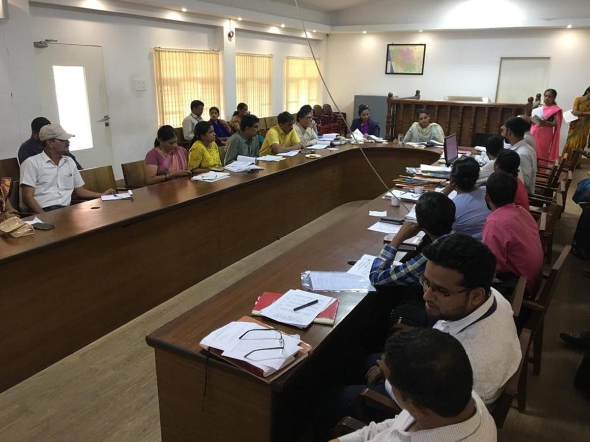 Deputy Commissioner Sindhu B Rupesh chairs a meeting at the DC's office in Mangaluru.