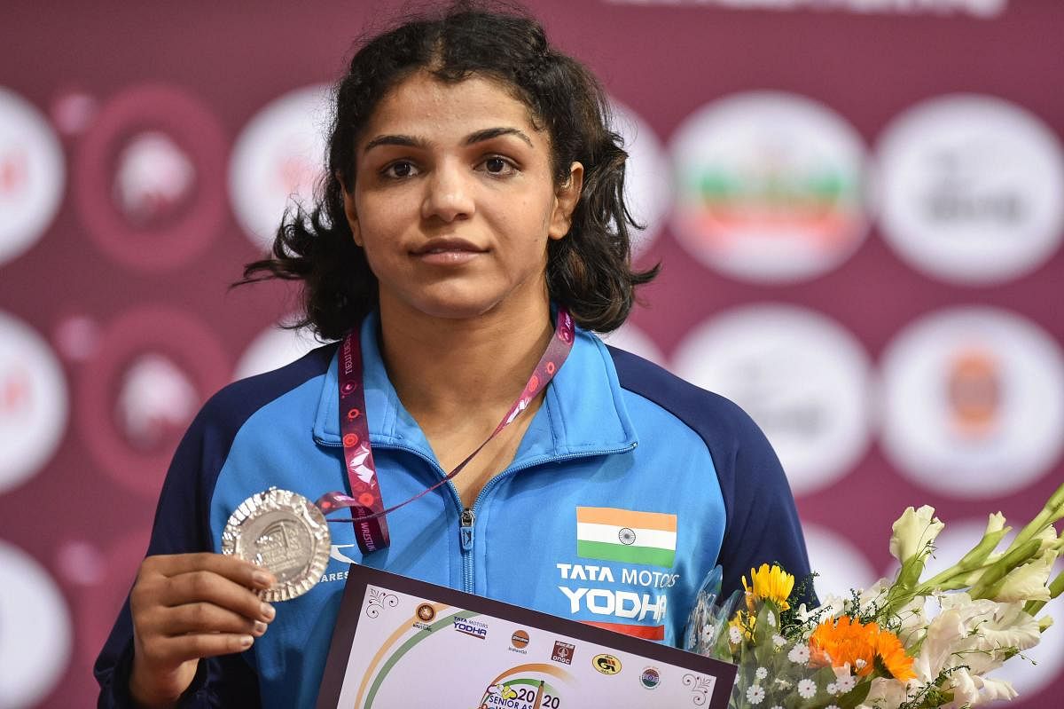 India's Sakshi Malik poses for photographs with her silver medal after losing to Japan's Naomi Rukie during the 65kg category match of the Asian Wrestling Championships in New Delhi, Friday, Feb. 21, 2020. Credit: PTI Photo