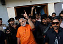 Indian state of Gujarat chief minister Narendra Modi gestures as he greets his supporters after casting his vote in the second phase of Gujarat state assembly elections in Ahmadabad, India, Monday, Dec. 17, 2012. Ninety-five seats go for polls on Monday in the second and last phase of Gujarat Assembly elections in which 19.8 million voters will decide the fate of 820 candidates including Chief Minister Narendra Modi, who is seeking his third term, according to local news agency Press Trust of India. (AP