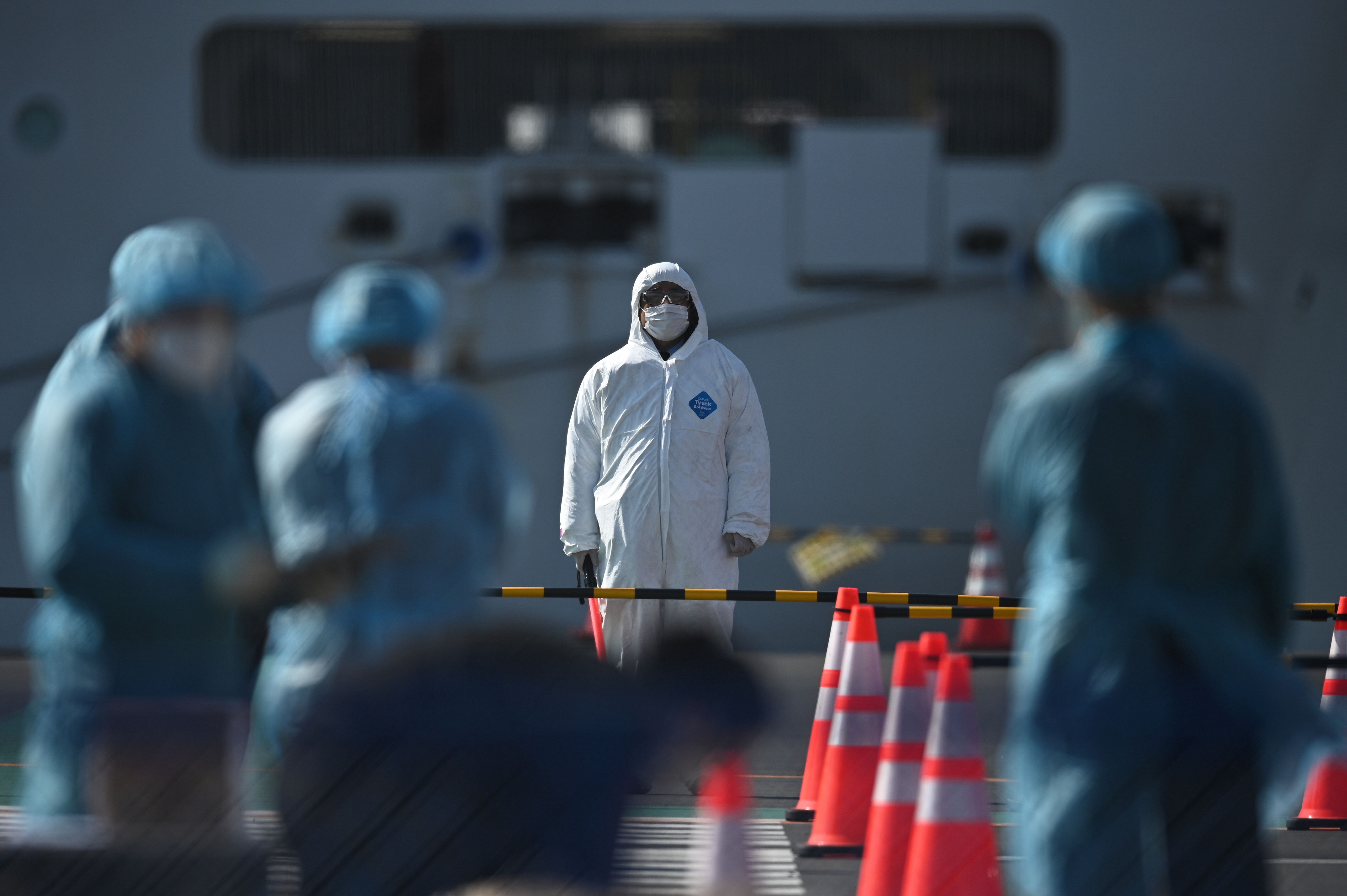 In Japan, 99 people have now tested positive for the flu-like illness, which has killed more than 2,300 in mainland China. (Credit: AFP Photo)