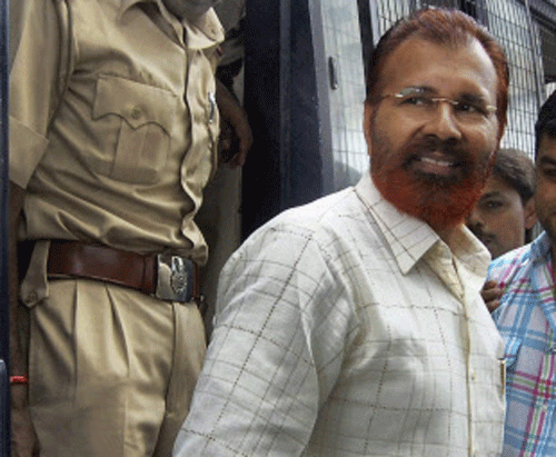 File photo of Gujarat IPS officer D G Vanzara being taken to a court in Ahmedabad in Aug 2010. Vanzara, suspended and behind the bars in a string of fake encounter cases, has resigned from service accusing Narendra Modi government of having failed to protect the jailed police officers who fought against 'Pakistan inspired terrorism'. PTI Photo