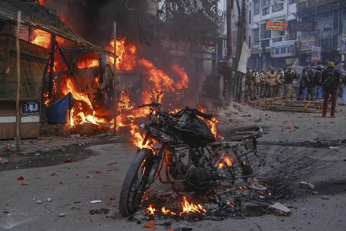  A vehicle torched allegedly by protestors during a demonstration against the Citizenship Amendment Act (CAA), in Kanpur, Saturday, Dec.21, 2019. Credit: PTI Photo
