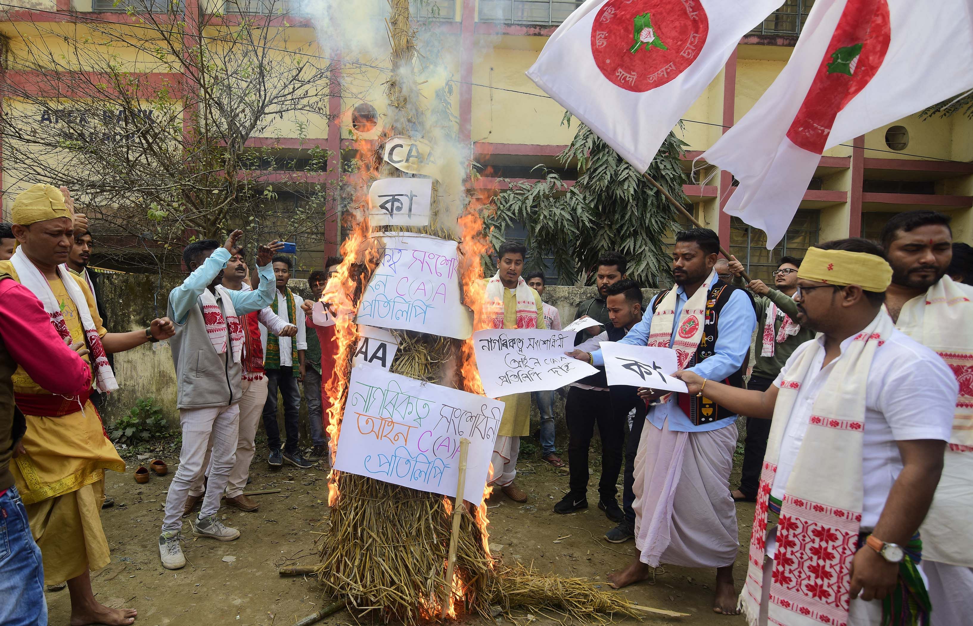  Members of All Assam Students Union burning the copies of Citizenship (Amendment) Act in the fire of Meji, traditional bonfire during Bhogali Bihu celebration in Nagaon district in Assam. (Photo by Anuwar Ali Hazarika)