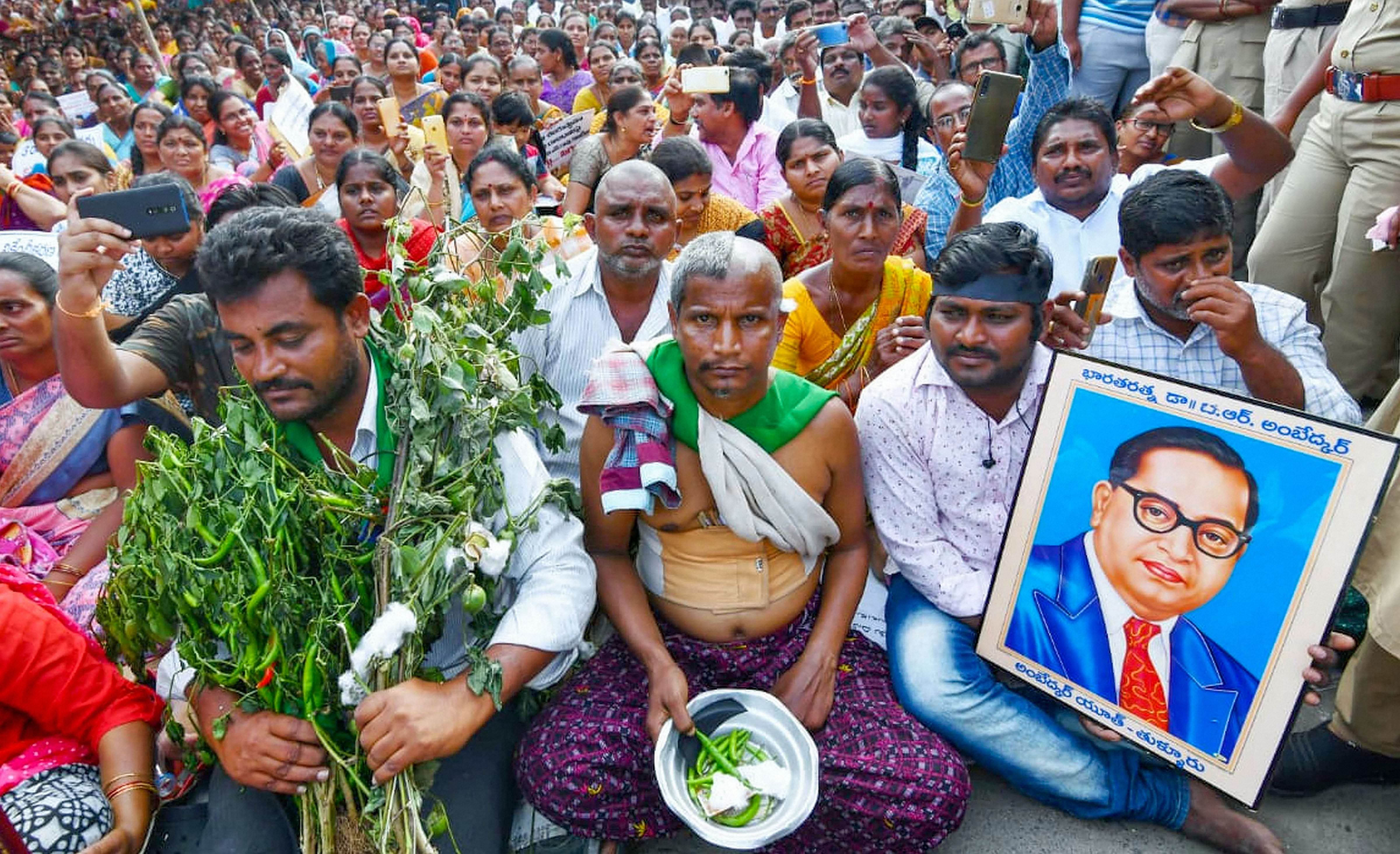 Demonstrators during a protest against three capital cities for the state of Andra Pradesh proposed by CM, at Velagapudi in Guntur. (PTI Photo)