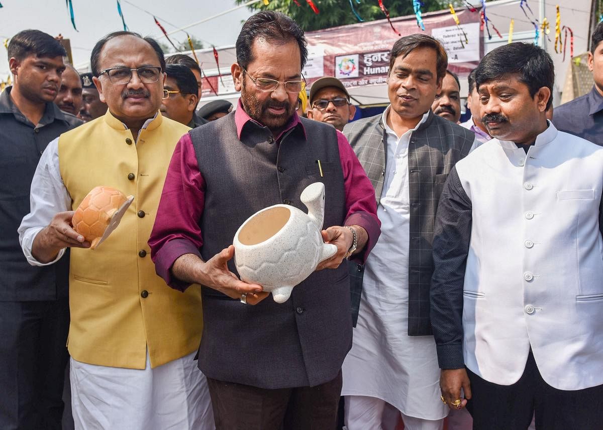 Union Minister of Minority Affairs Mukhtar Abbas Naqvi with UP Cabinet Minister Sidharth Nath Singh, UP Minister of Stamp and Civil Aviation Nand Gopal Gupta. (PTI PHOTO)