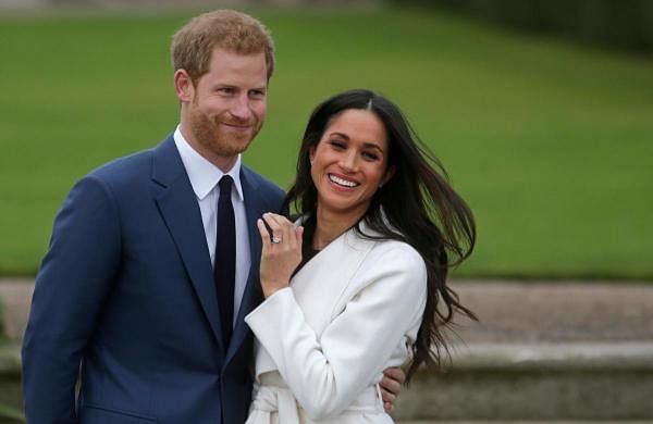 Britain's Prince Harry and his wife Meghan. (AFP Photo)