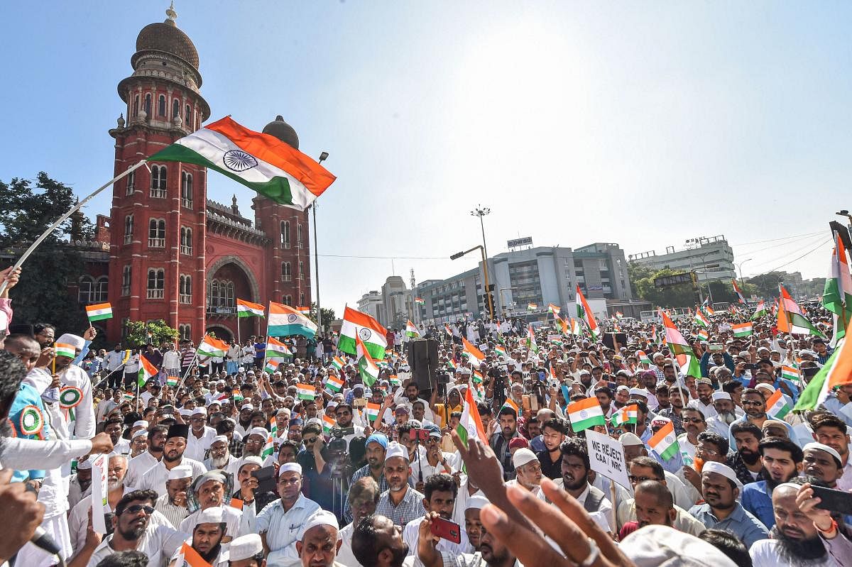 Protestors wave tri-colours during a demonstration against the Citizenship Amendment Act (CAA), in Chennai, Friday, Jan. 24, 2020. (PTI Photo)