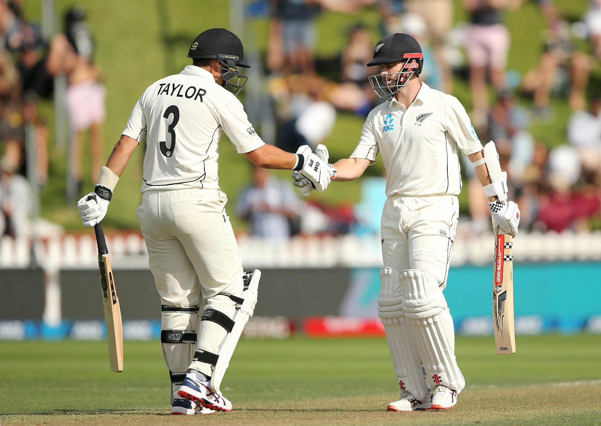 New Zealand's Kane Williamson celebrates his half century with Ross Taylor (REUTERS Photo)