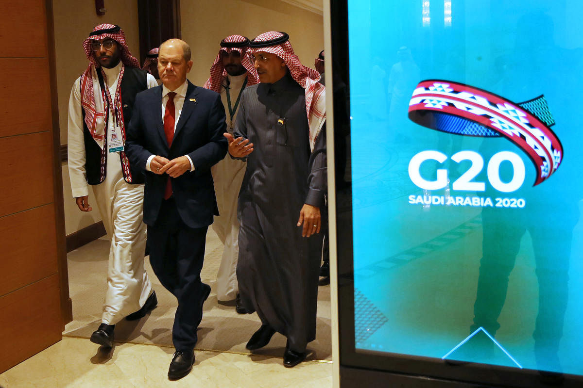 German Finance Minister Olaf Scholz and Saudi Minister of Finance Mohammed al-Jadaan walk to the G20 finance ministers and central bank governors meeting hall in Riyadh, Saudi Arabia. (REUTERS Photo)
