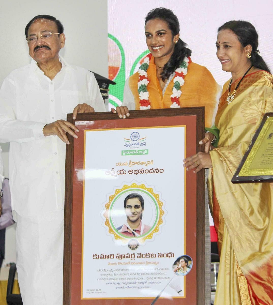 At another event organised by Swarna Bharat Trust near here, Naidu felicitated three Padma Awardees from Telangana - ace badminton player P V Sindhu. Credit: PTI Photo