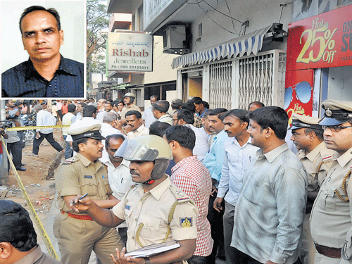 Curious onlookers gathered outside Rishab Jewellers in Rajajinagar on March 23, 2013, the day its owner, Shravan Kumar Pokarna (inset), was brutally murdered. DHfile photo