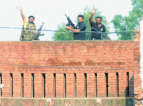 Security personnel react after the encounter