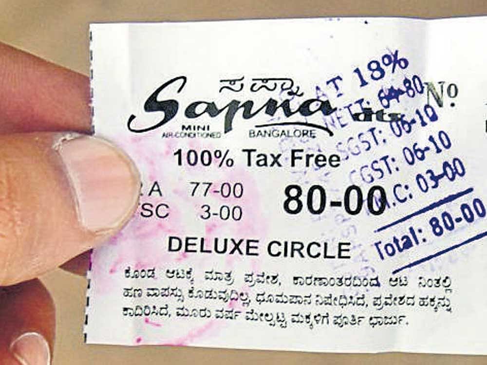 This movie ticket shows the break-up of the share of the state government and the central government in the GST levied. dh file photo &#8200;