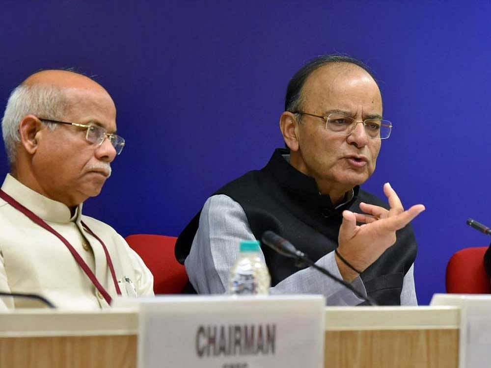 Union Finance Minister Arun Jaitley with MoS for Finance Shiv Pratap Shukla and Revenue Secretary Hasmukh Adhia addressing media after the 22nd meeting of the Goods and Services Tax (GST) Council, in New Delhi on Friday. PTI Photo