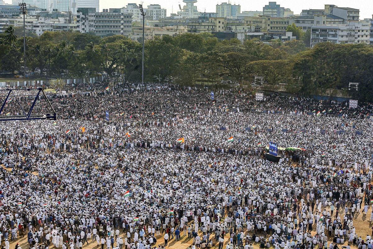 Protestors participate in a rally against CAA, NRC and NPR at Azad Maidan in Mumbai. (PTI Photo)