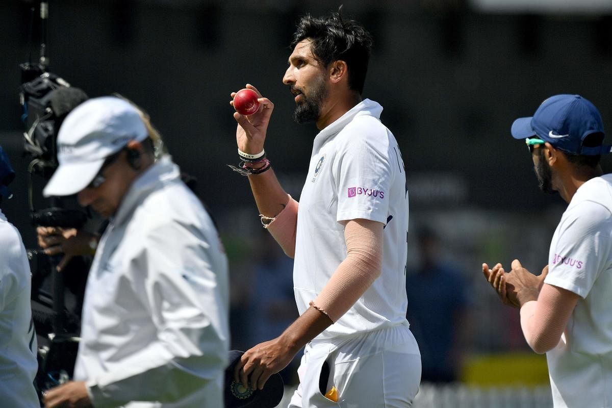 Ishant Sharma celebrates a 5 wicket bag as he walks from the field at lunch during day three of the first Test cricket match between New Zealand and India. (AFP Photo)