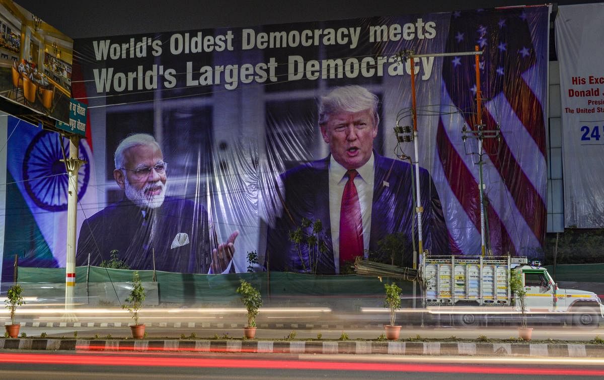  A view of a hoarding with images of Prime Minister Narendra Modi and US President Donald Trump, ahead of Trump’s maiden visit to India, in Agra, Saturday, Feb. 22, 2020. Credit: PTI Photo