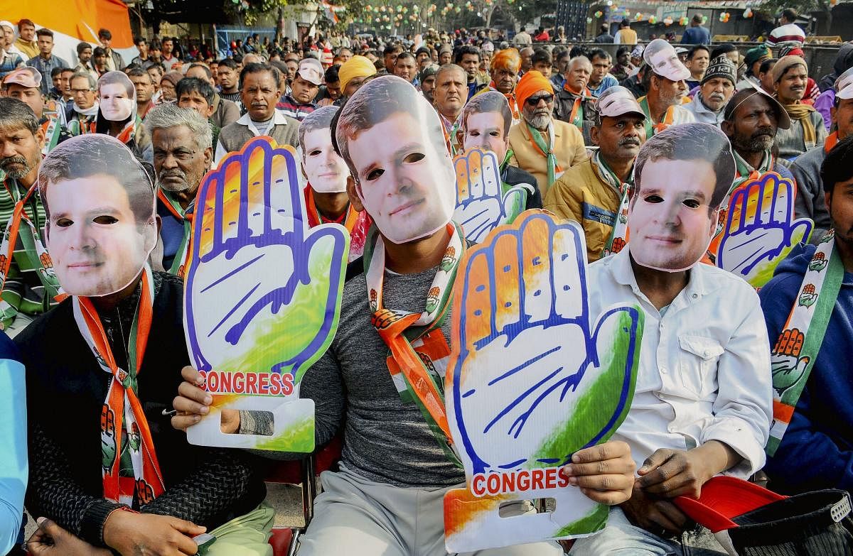 Supporters of Congress party attend an election campaign rally by party leader Rahul Gandhi (unseen) ahead of the State Assembly Polls at Kalyan Puri in New Delhi, Wednesday, Feb. 5, 2020. (PTI Photo)
