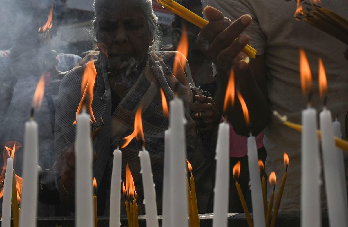 Sri Lankan Christians light candles outside St. Anthony's Church in Colombo on May 21, 2019, a month after a series of deadly Easter Sunday blasts targeting churches and luxury hotels. (AFP Photo)