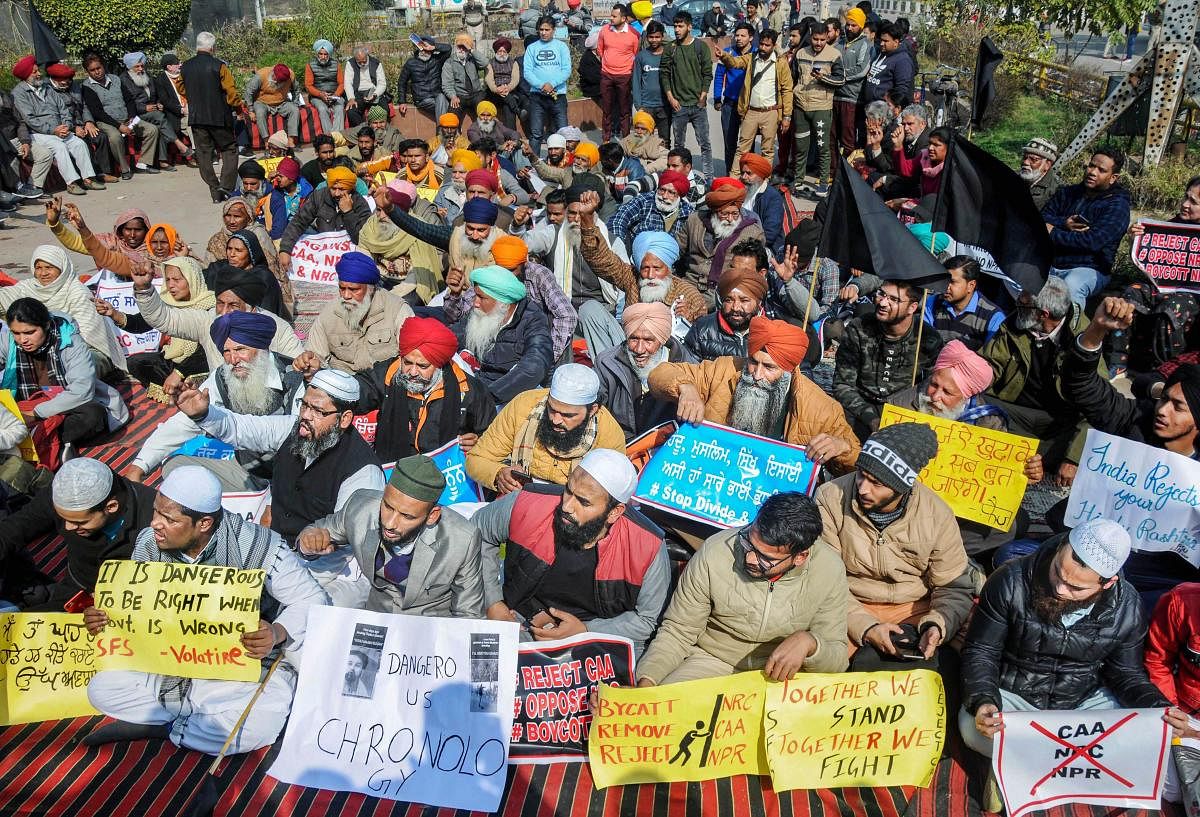 People hold placards and raise slogans during a protest march against the Citizenship Amendment Act (CAA), National Register of Citizens (NRC), the National Population Register (NPR), in Amritsar, Sunday, Feb. 2, 2020. (PTI Photo)
