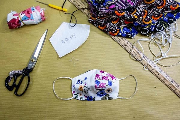 Faced with shortages in the midst of a virus outbreak, Hong Kongers have started making their own face masks, from professional factories to seamstresses churning out coverings on sewing machines. (AFP Photo)
