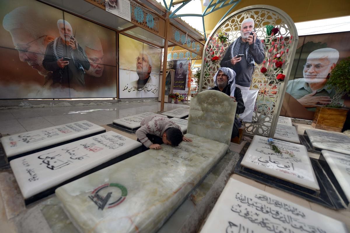 Al-Muhandis was killed alongside a top Iranian general in a US drone strike in Baghdad on January 3, and his final resting place in the world's largest cemetery has gained near-holy status, becoming an anti-US magnet and a stop for thousands of Shiite pilgrims who pass through Najaf each day to visit the tomb of Imam Ali, son-in-law of the Prophet Mohammed. (Photo by AFP)