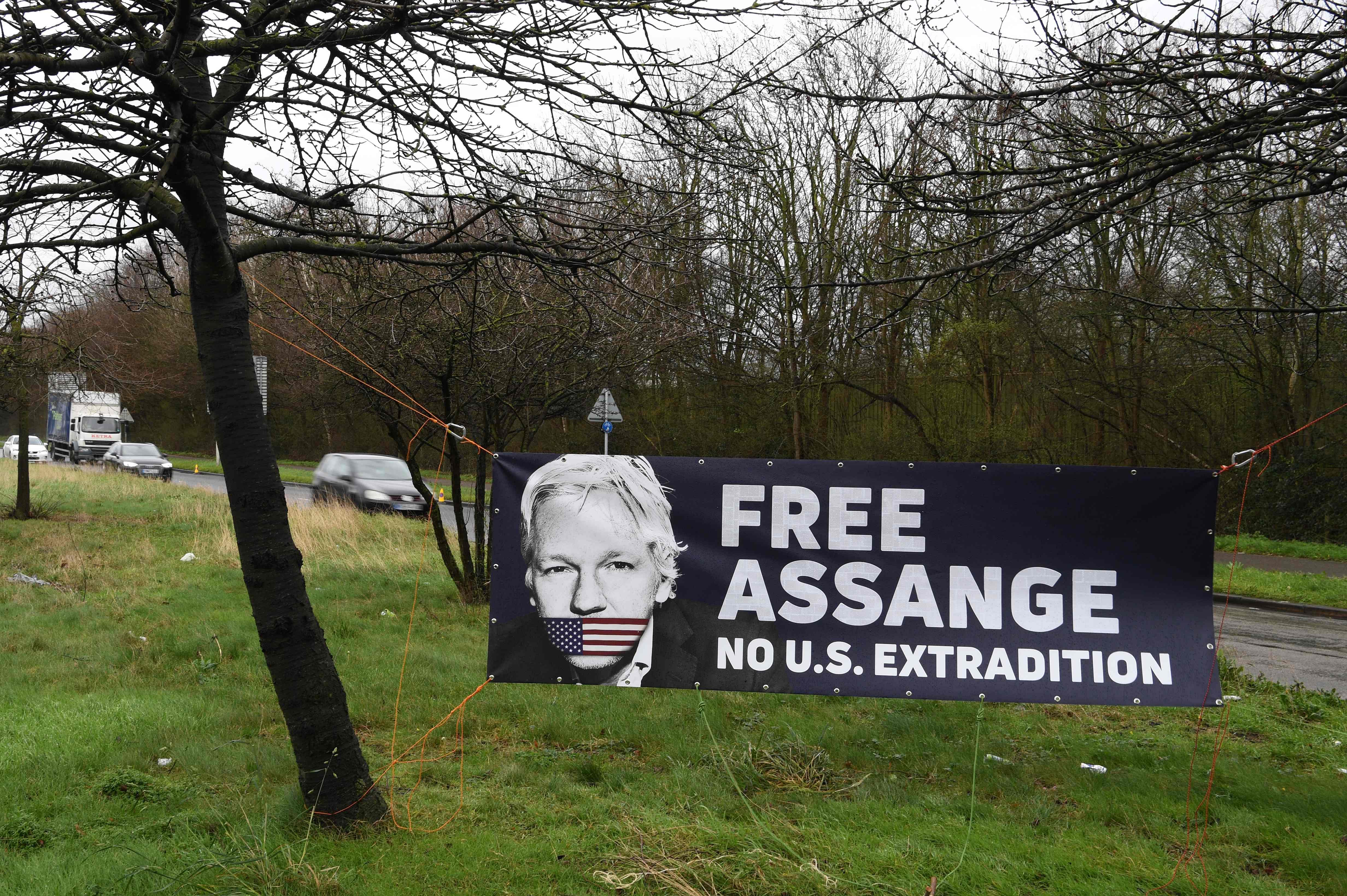 A banner raised by supporters of WikiLeaks founder Julian Assange calling for his freedom is seen on the road outside Woolwich Crown Court in southeast London. (AFP Photo)