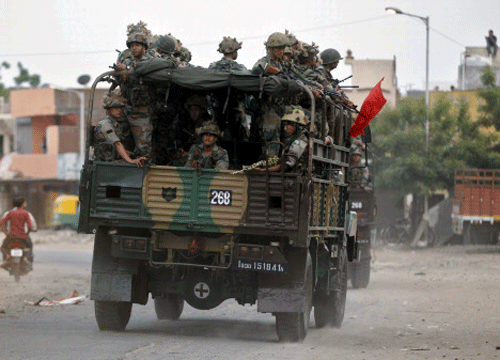 Army soldiers patrol after clashes between police and protesters in Ahmedabad. Reuters photo