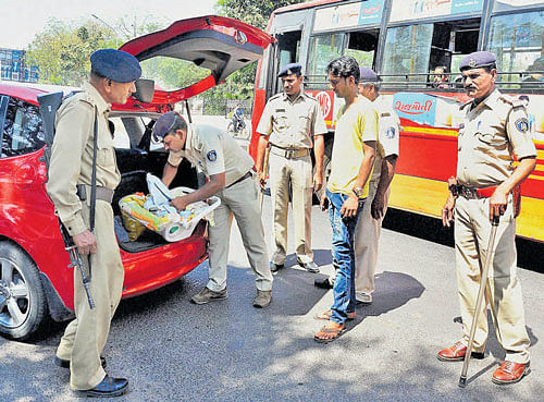 Police check a vehicle in Ahmedabad on Sunday following the IB's warning of a possible terror attack on Gujarat. PTI