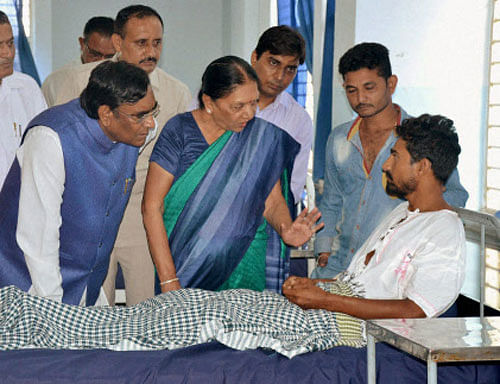 Gujarat Chief Minister Anandiben Patel visits a dalit member who was assaulted by cow protectors recently, at a hospital in Rajkot district. PTI Photo