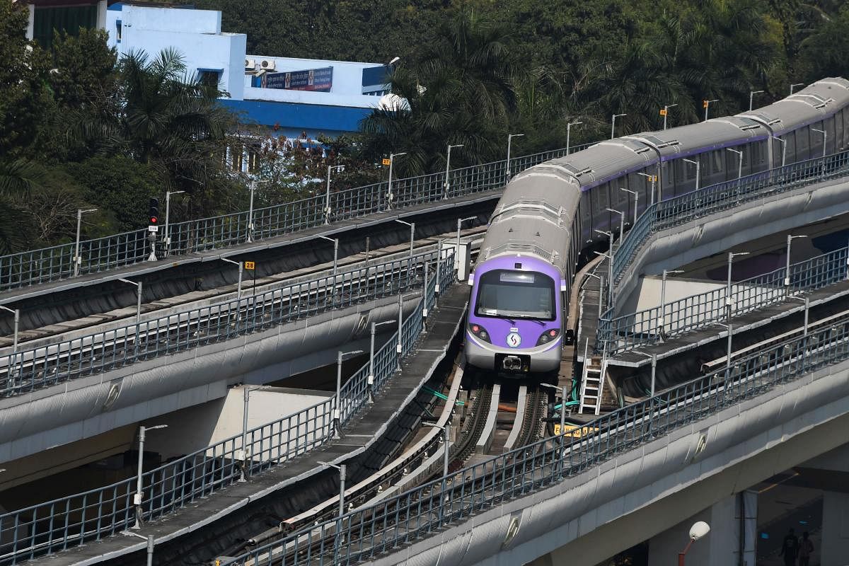 A train of the East-West metro line is seen during a test run on the eve of its inauguration in Kolkata on February 12, 2020. (Photo by Dibyangshu SARKAR / AFP)