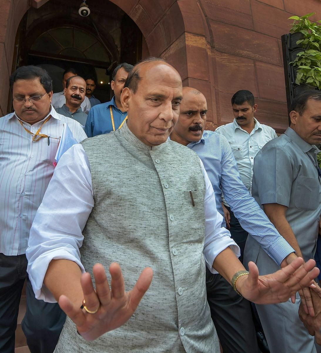 Home Minister Rajnath Singh leaves during the Monsoon Session of Parliament, in New Delhi on Monday, July 23, 2018. PTI Photo