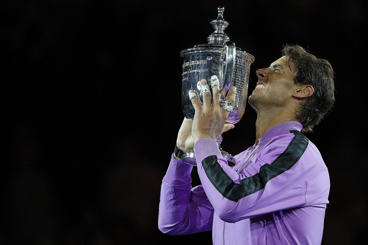 Rafael Nadal of Spain celebrates with the championship trophy after winning Grand slam title in U.S. Open. (Image USA TODAY Sports)