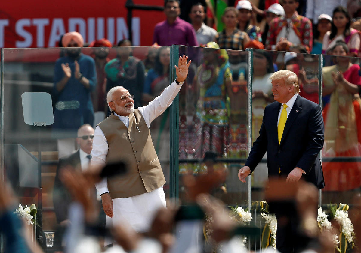 India's Prime Minister Narendra Modi waves next to U.S. President Donald Trump as they attend the "Namaste Trump" event at Sardar Patel Gujarat Stadium, in Ahmedabad, India, February 24, 2020. (Reuters Photo)